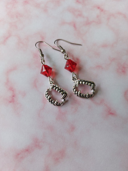 beaded vampire fang earrings - red